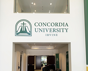 A wall graphic above an entryway. Text: Concordia University Irvine.