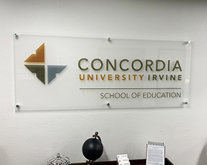 Acrylic sign. Text: Concordia University Irvine, School of Education.