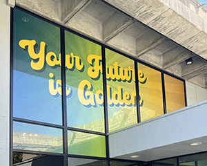 Window clings on the building window says Your Future is Golden